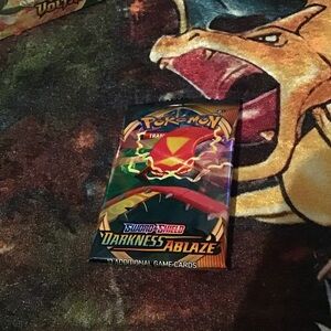 Pokemon Darkness Ablaze Booster Pack with Red and Yellow Design
